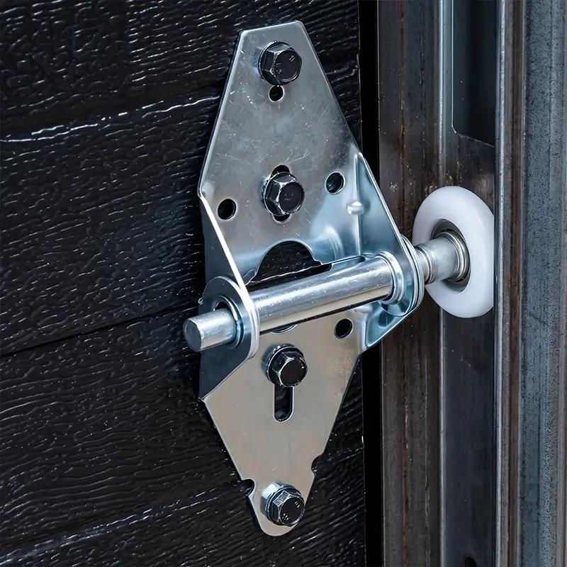 Technician servicing garage door rollers and track guidance in Tomball Texas
